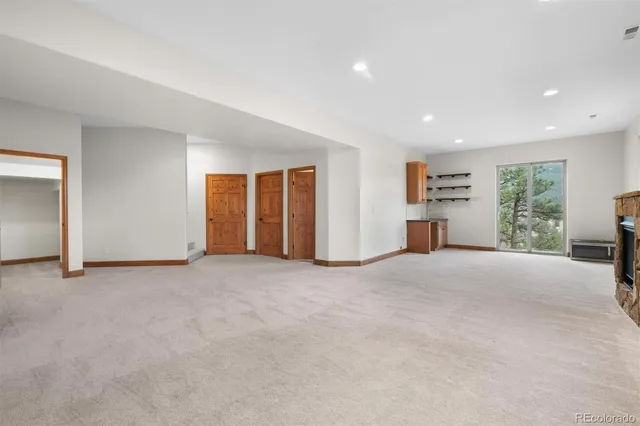 an empty room with closet area