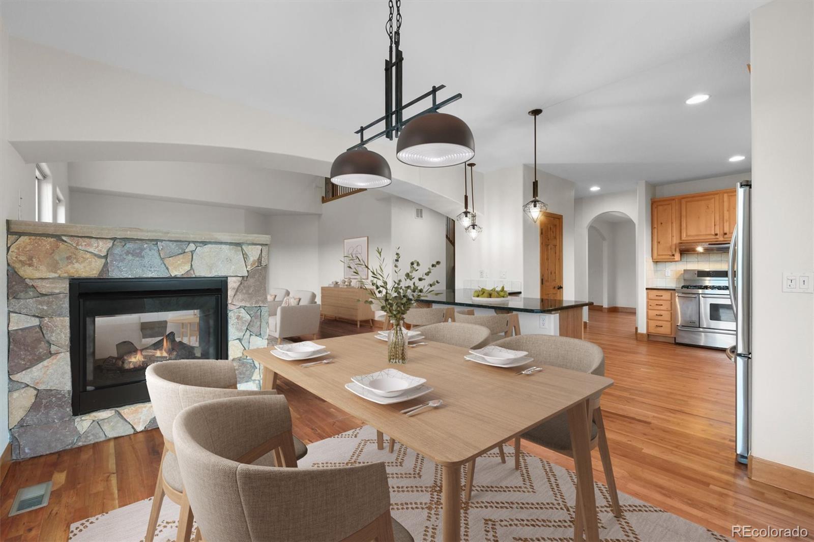 3191 Bittersweet Lane Evergreen, CO 80439 - Photo 4 of 40 a dining room with furniture and wooden floor