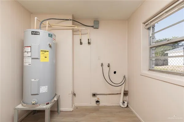 a bathroom with a granite countertop a sink a mirror and a shower