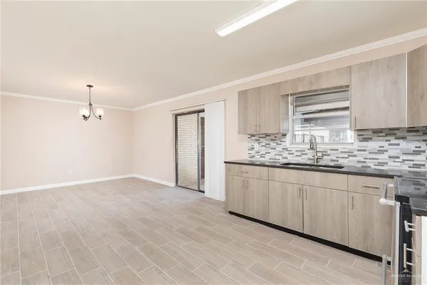 a bathroom with granite countertop a sink and a mirror