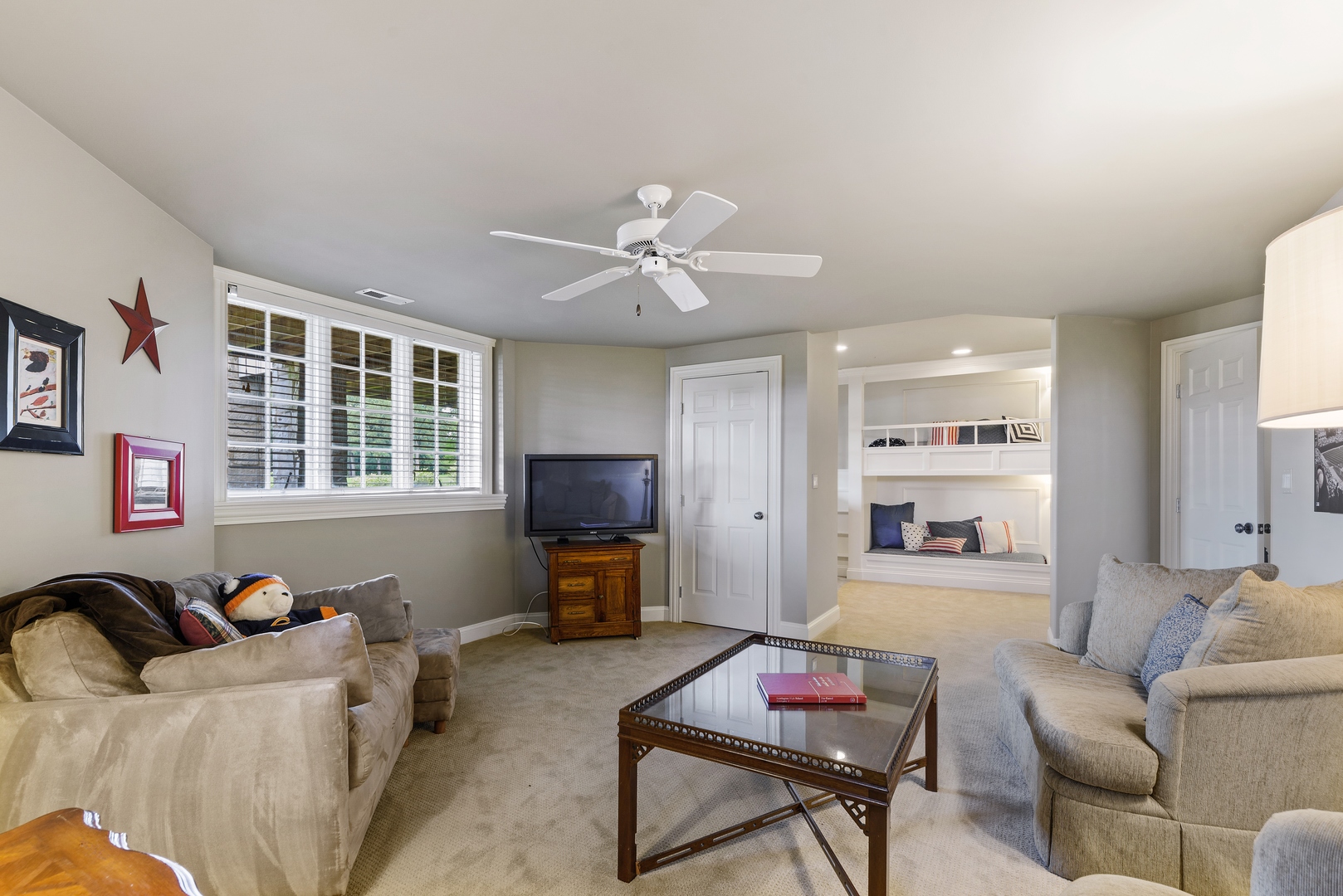 35 Riderwood Road North Barrington, IL 60010 - Photo 28 of 35 a living room with furniture a flat screen tv and a window
