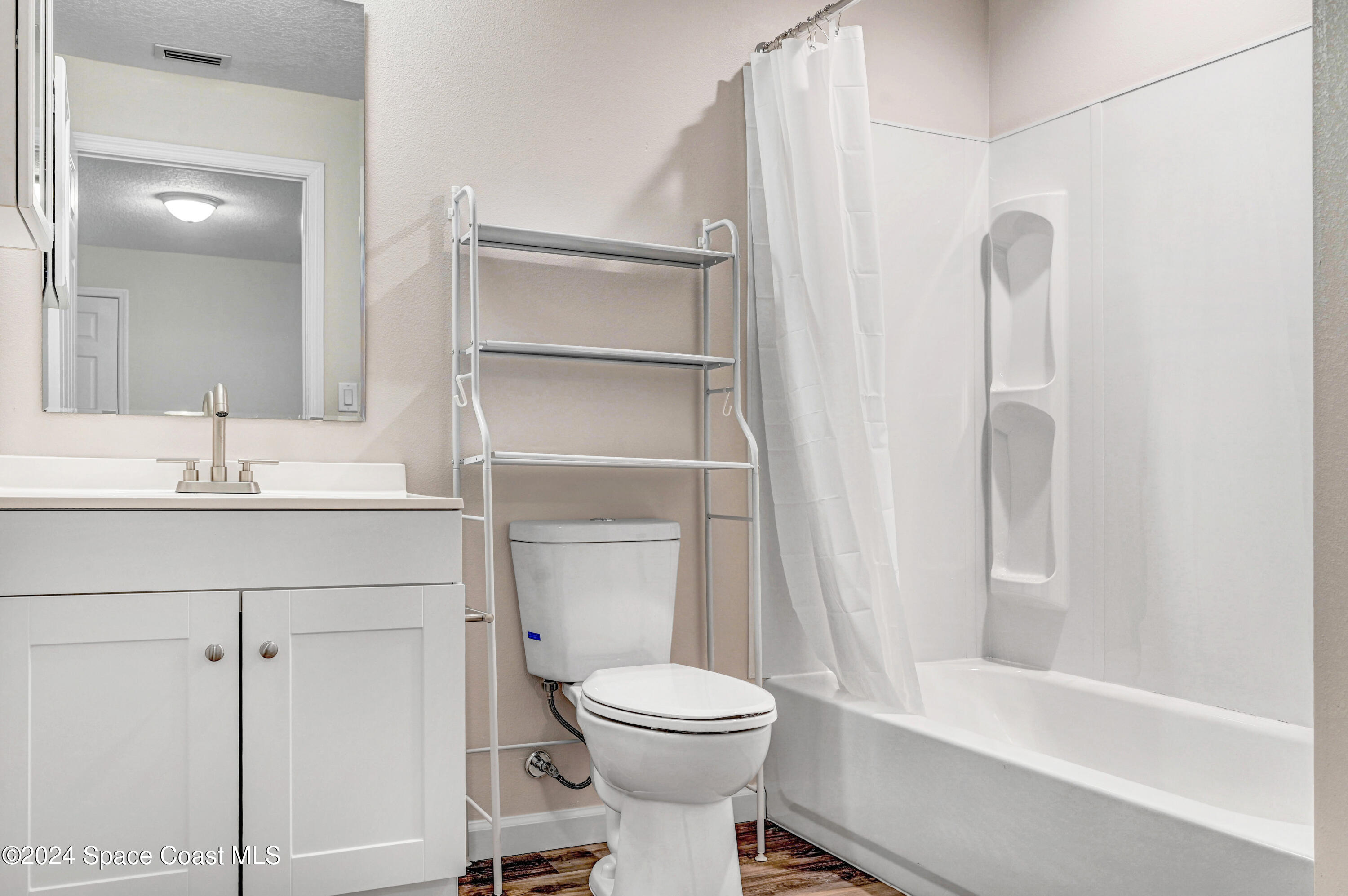 1895 Convair Street Southeast, Unit 2102 Palm Bay, FL 32909 - Photo 12 of 16 a bathroom with a sink toilet and shower