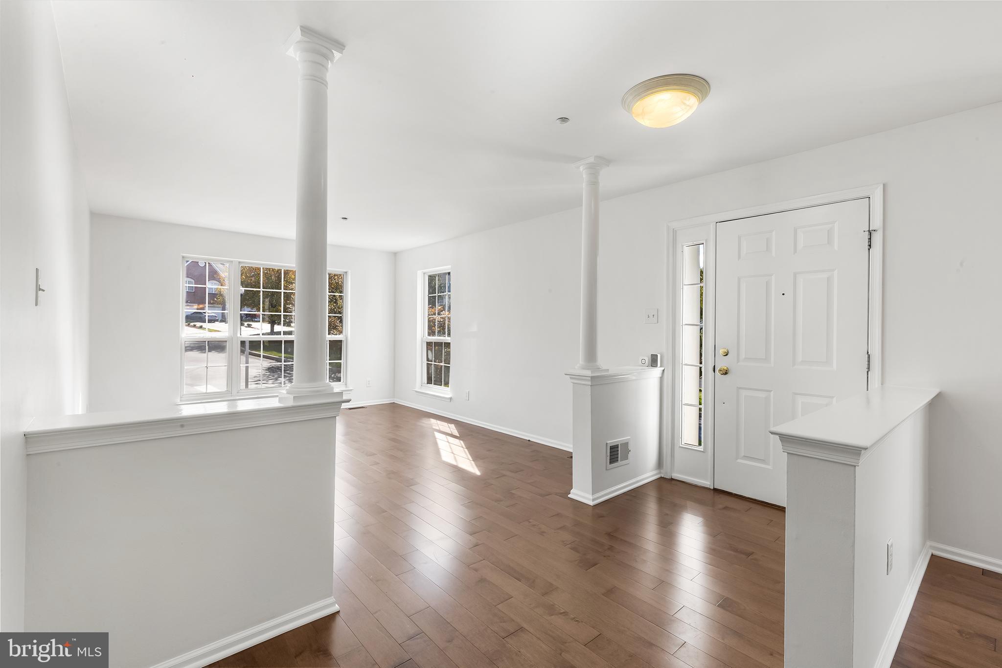 272 Militia Drive Wayne, PA 19087 - Photo 11 of 57 a view of an empty room with wooden floor and a window