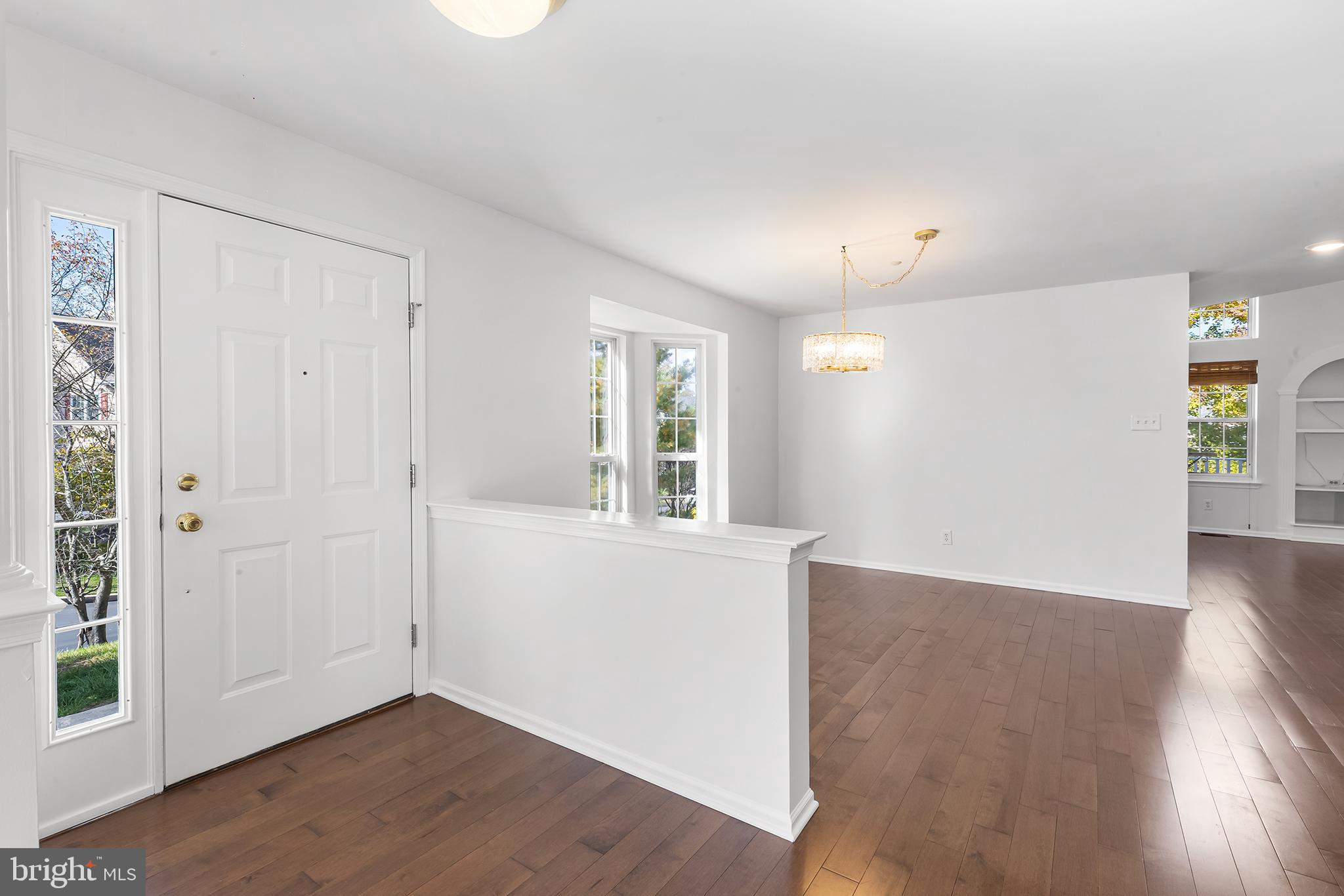 272 Militia Drive Wayne, PA 19087 - Photo 7 of 57 wooden floor in an empty room with a window
