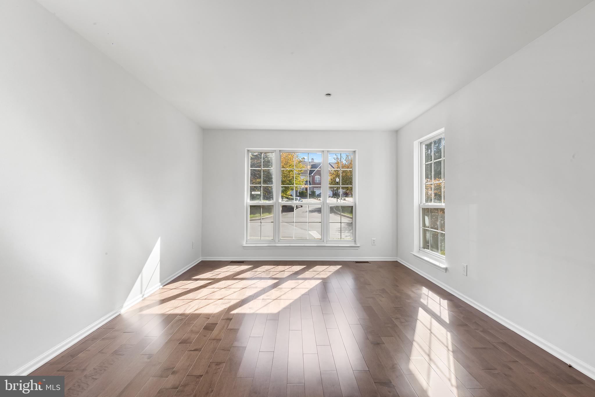 272 Militia Drive Wayne, PA 19087 - Photo 8 of 57 an empty room with wooden floor and windows