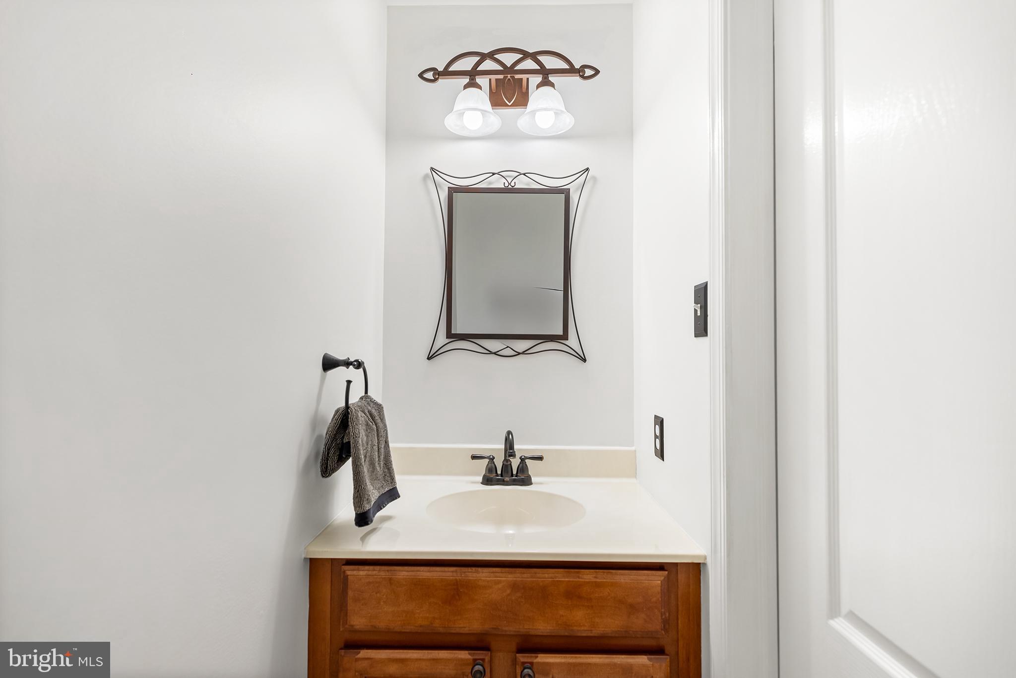 272 Militia Drive Wayne, PA 19087 - Photo 10 of 57 a bathroom with a sink and a mirror