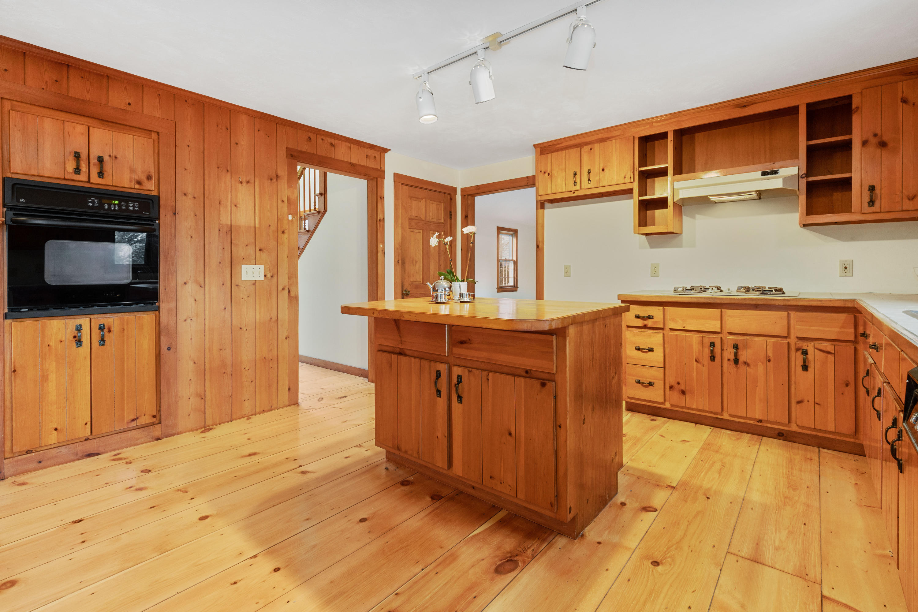 1375 Old Post Road Marstons Mills, MA 02648 - Photo 4 of 27 a kitchen with stainless steel appliances granite countertop a sink dishwasher stove and wooden cabinets