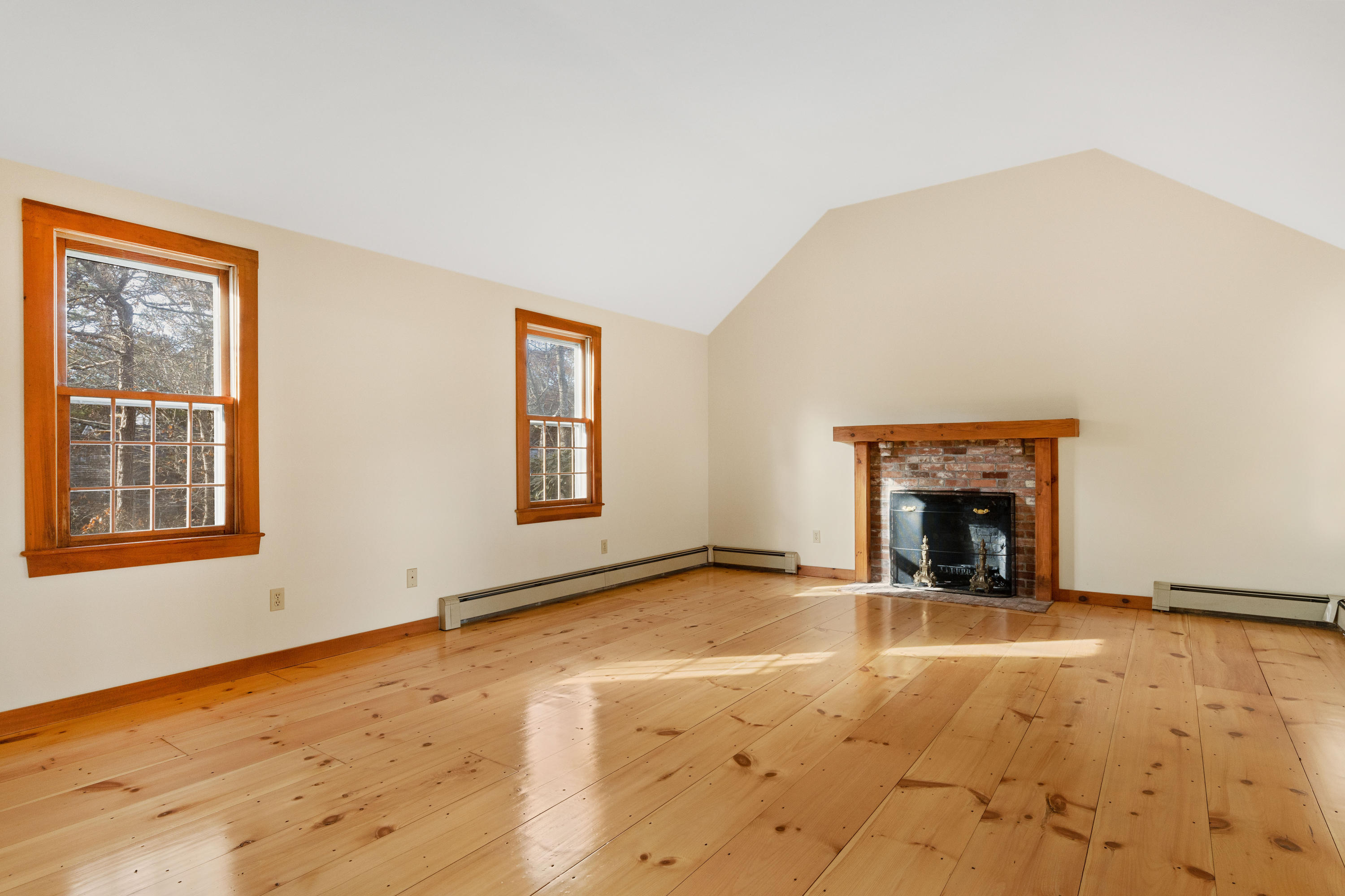 1375 Old Post Road Marstons Mills, MA 02648 - Photo 8 of 27 a view of an empty room with a fireplace and a window