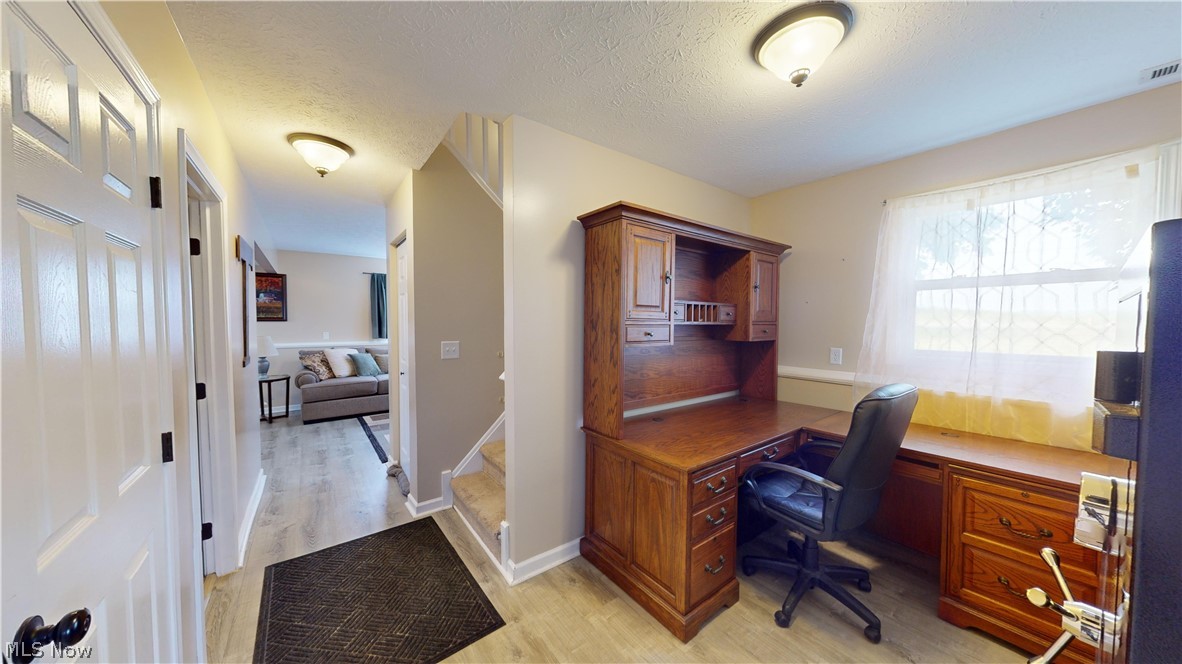 3805 Townline Road Madison, OH 44057 - Photo 24 of 38 Office space with light wood-type flooring and a textured ceiling