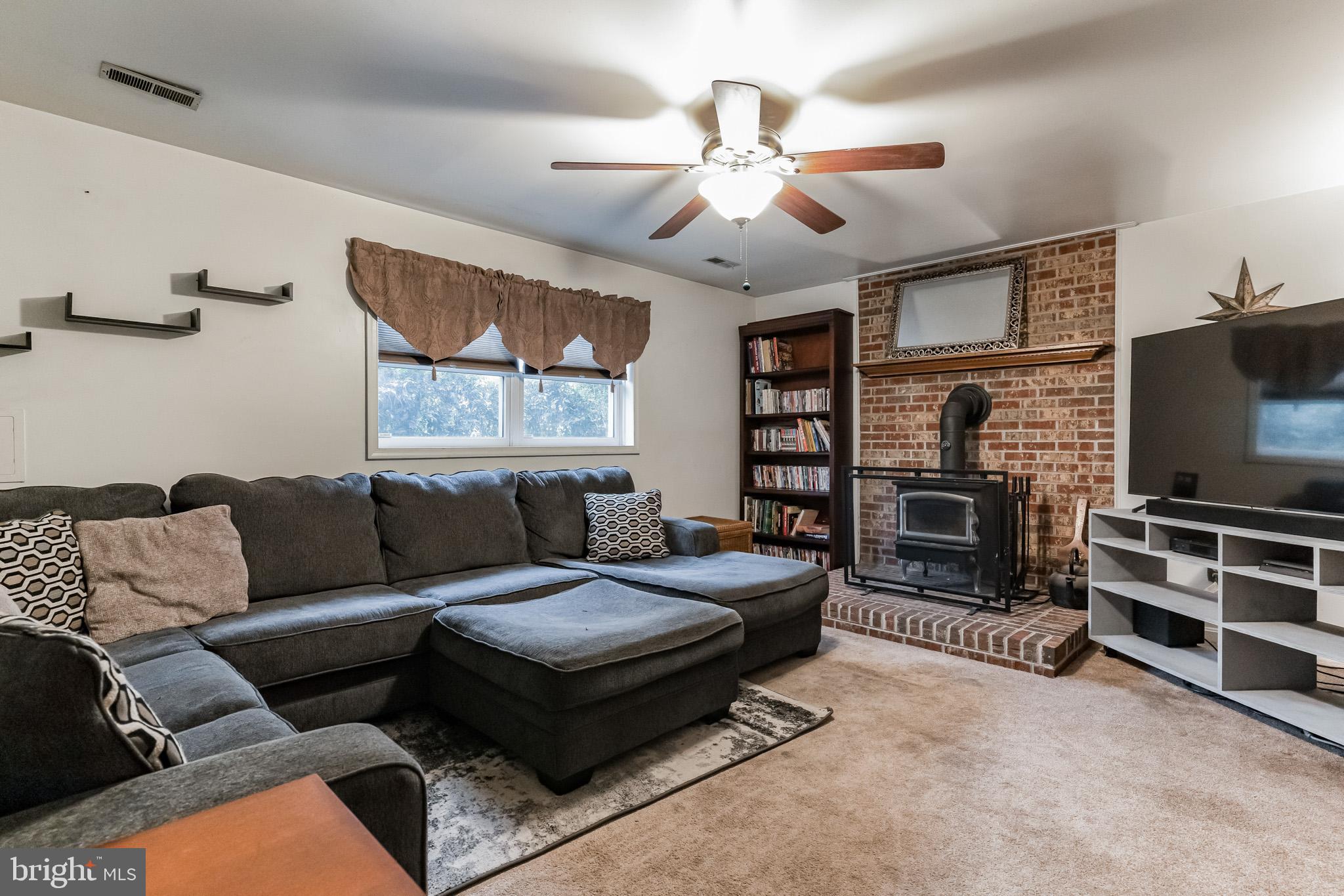 5 True Road Stafford, VA 22556 - Photo 6 of 35 Lower level family room with wood stove