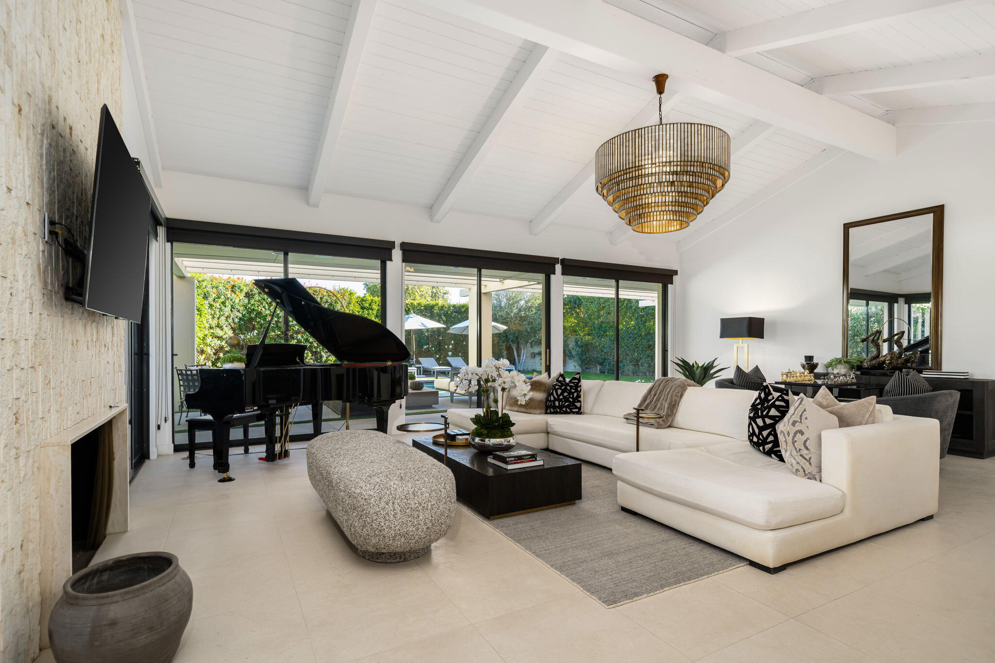 6 Exeter Court Rancho Mirage, CA 92270 - Photo 15 of 54 a living room with furniture chandelier and a large window