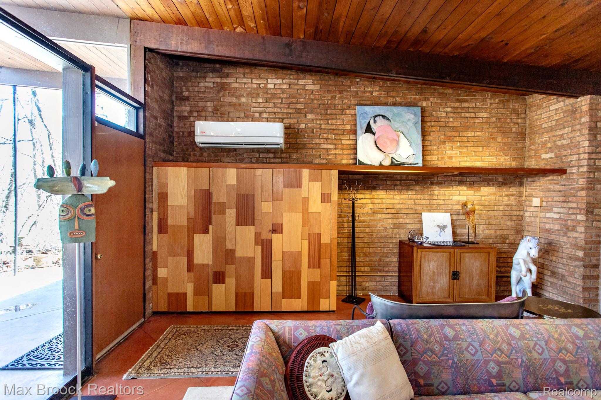 30875 Franklin Road Franklin, MI 48025 - Photo 14 of 86 Living area with brick wall, a mini split for heating / cooling, and wooden ceiling
