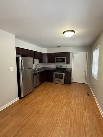 a bathroom with a bathtub a sink and a mirror