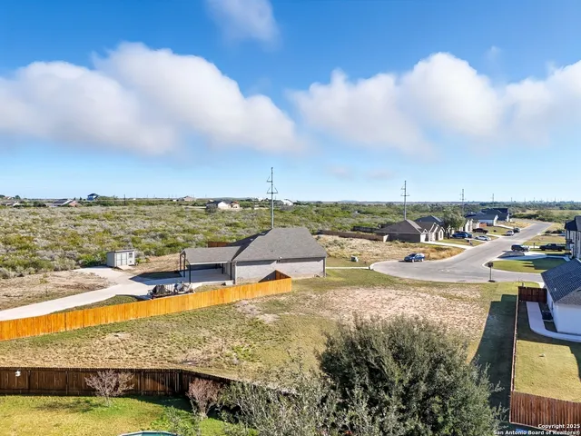 an aerial view of residential building and lake view