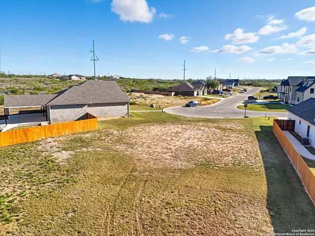 a view of a swimming pool and an outdoor space
