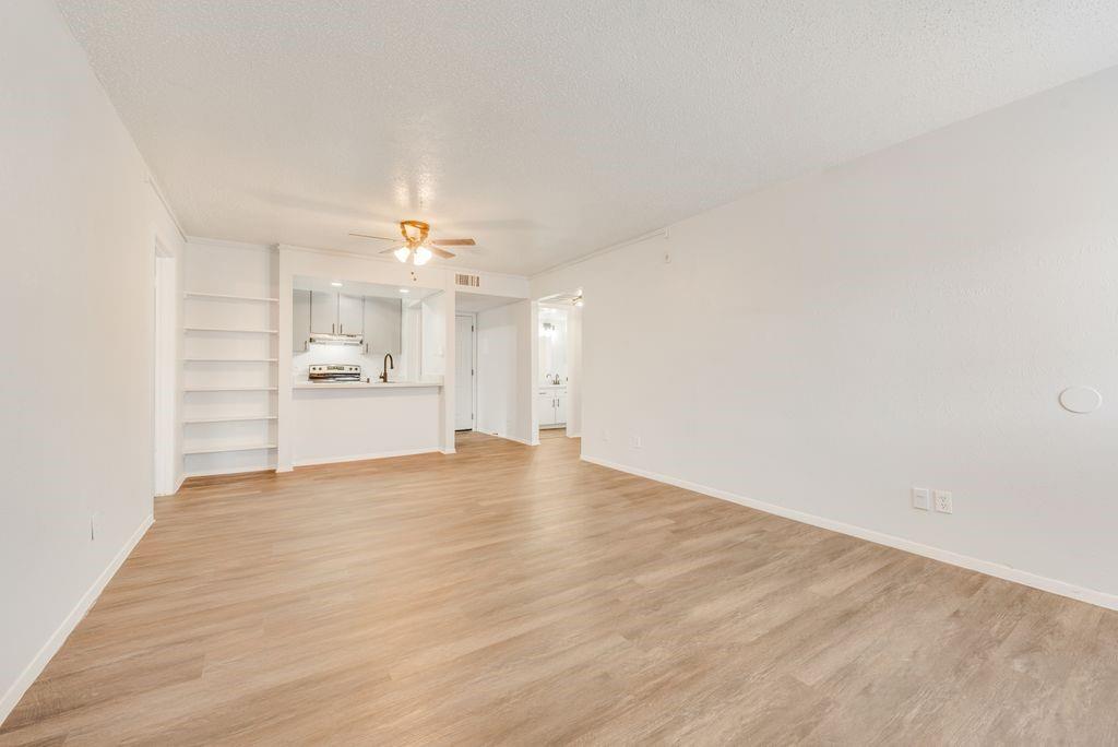 5514 Boca Raton Boulevard, Unit 438 Fort Worth, TX 76112 - Photo 6 of 25 a view of empty room with wooden floor