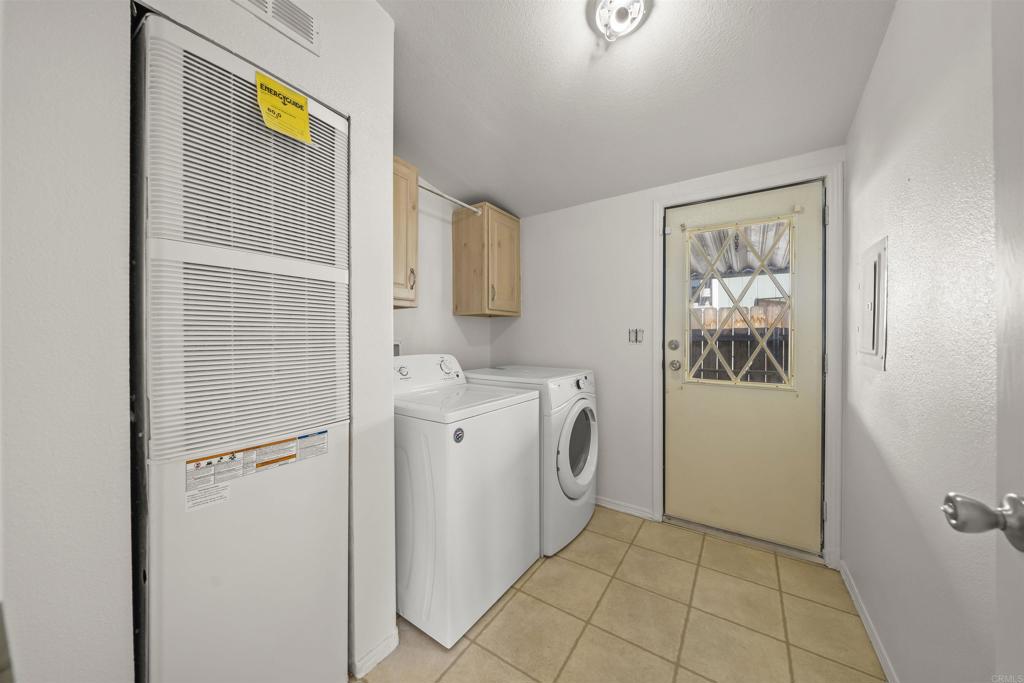 9902 Jamacha Boulevard, Unit 13 Spring Valley, CA 91977 - Photo 12 of 26 a view of a storage and utility room with washer and dryer