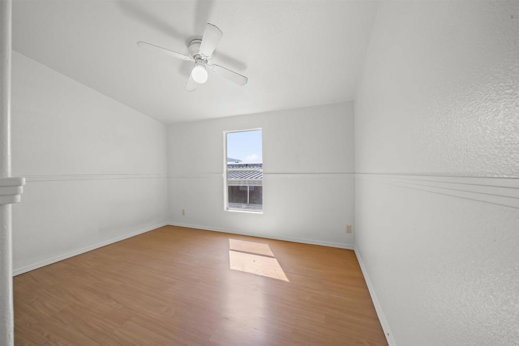 9902 Jamacha Boulevard, Unit 13 Spring Valley, CA 91977 - Photo 14 of 26 an empty room with a window and a fan