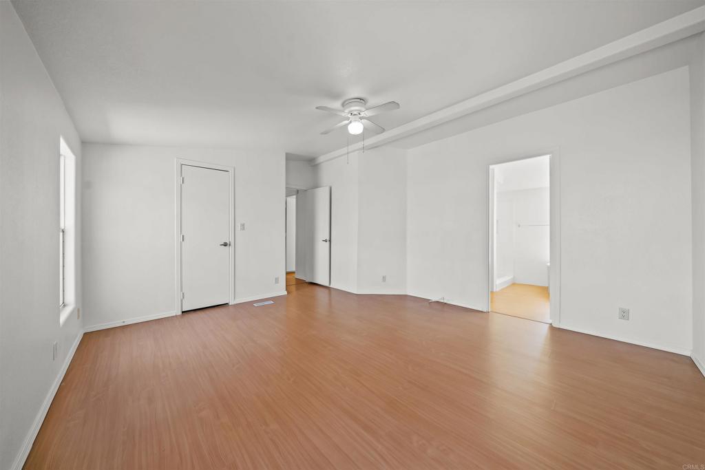 9902 Jamacha Boulevard, Unit 13 Spring Valley, CA 91977 - Photo 17 of 26 a view of an empty room with wooden floor