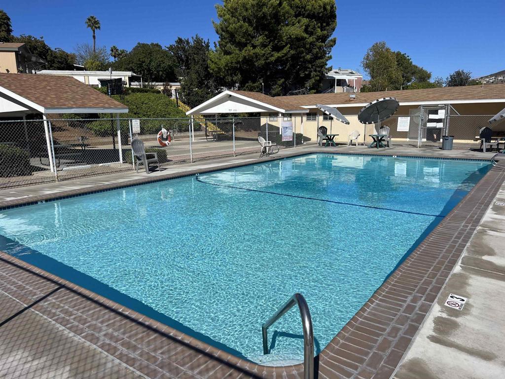 9902 Jamacha Boulevard, Unit 13 Spring Valley, CA 91977 - Photo 25 of 26 a view of a patio with chairs and a table