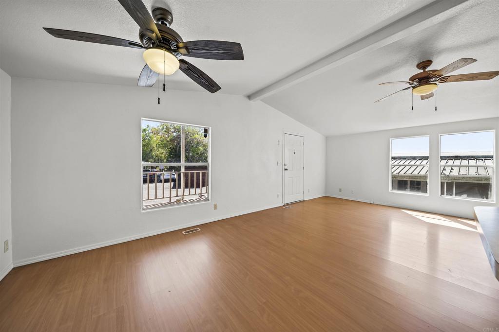9902 Jamacha Boulevard, Unit 13 Spring Valley, CA 91977 - Photo 10 of 26 a view of an empty room with a window and wooden floor