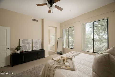 a bed room with a bed and a television