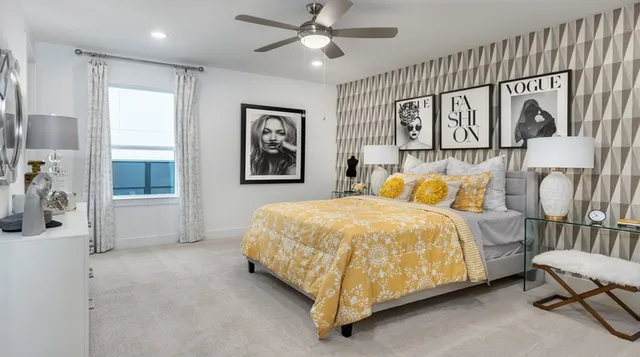 a bed room with a bed and a painting on the wall