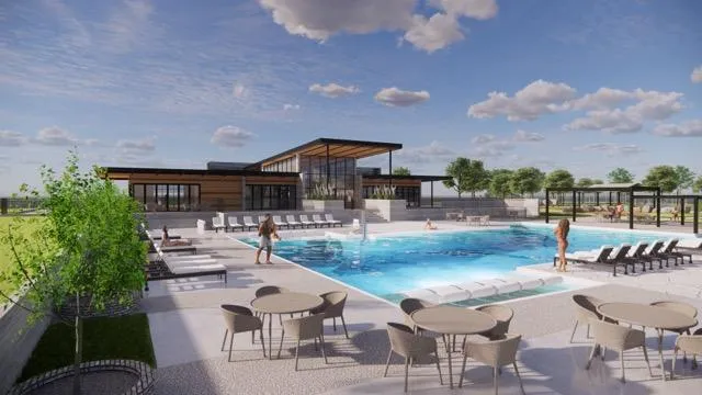 a view of a swimming pool with seating area