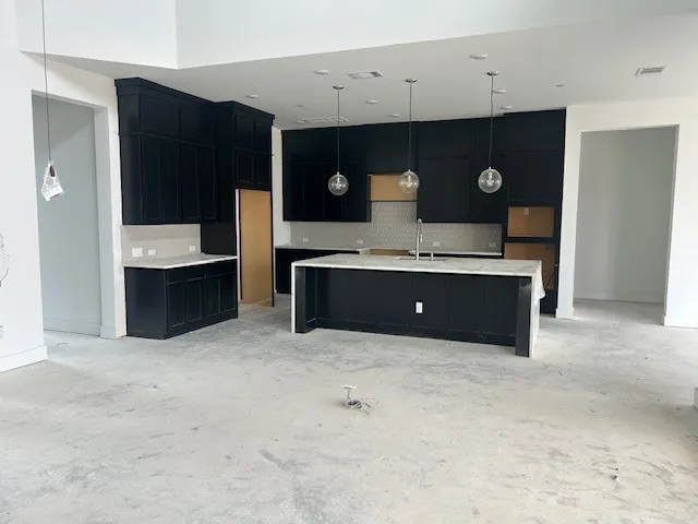 a living room with window and furniture
