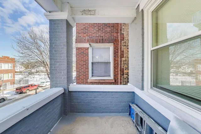 a bathroom with a bathtub and window