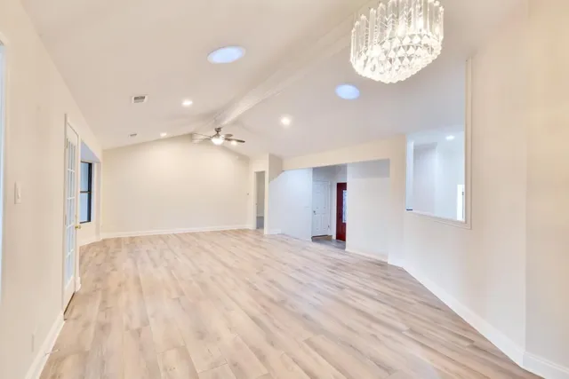 a view of empty room with a ceiling fan
