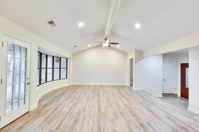 a view of an empty room and window