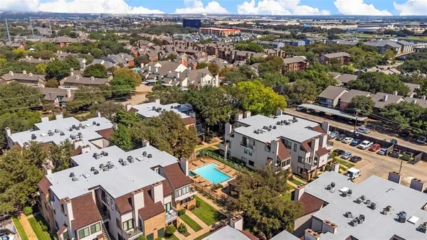 an aerial view of a city with lots of residential buildings