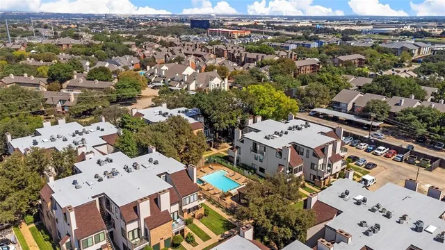 an aerial view of a city with lots of residential buildings