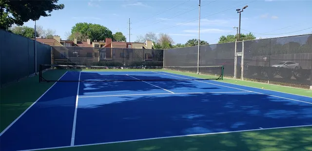 a bathroom with a granite countertop sink a toilet and a mirror