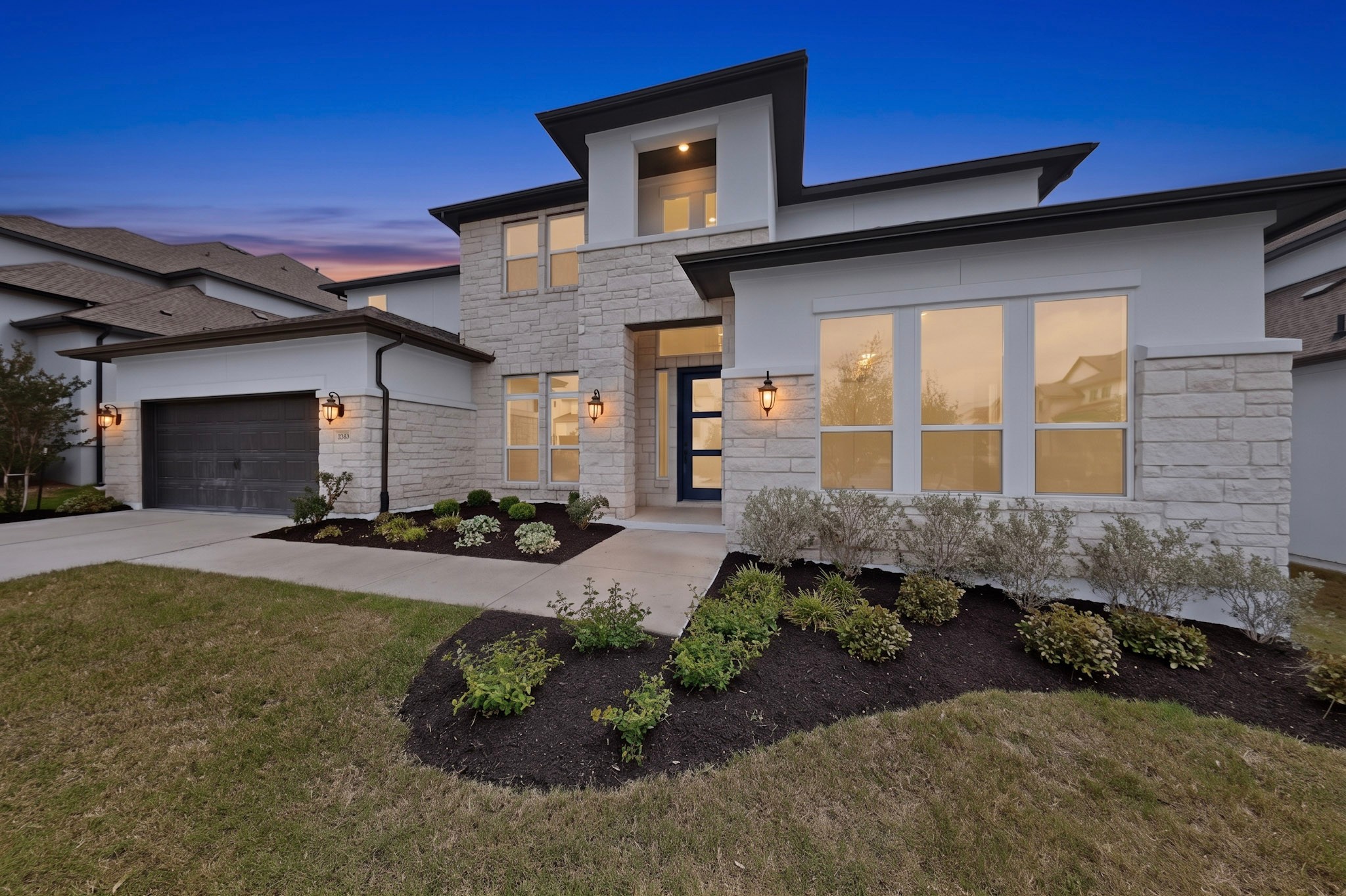 2308 Mondello Path Leander, TX 78641 - Photo 2 of 39 Modern architecture with clean lines and abundant windows provides an inviting and distinctive facade.