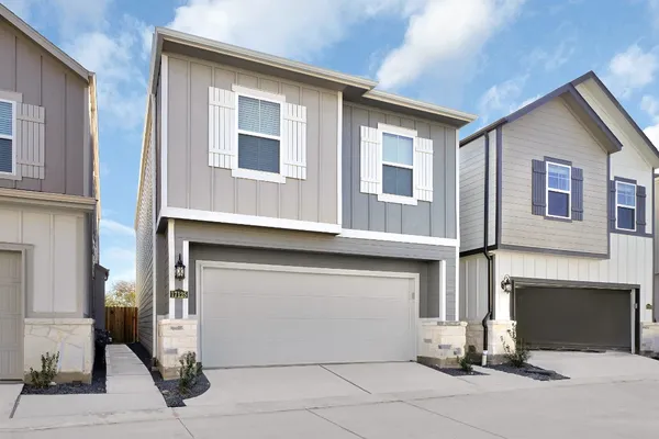 a front view of a house with a garage