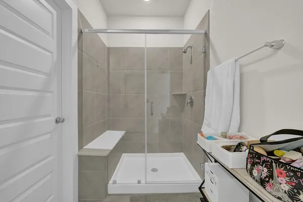 a spacious bathroom with double vanity and a mirror