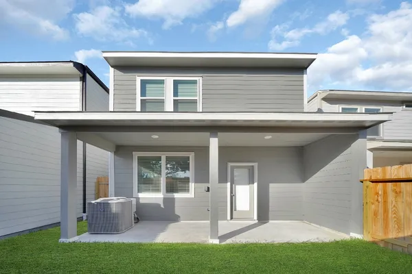 a view of house with backyard