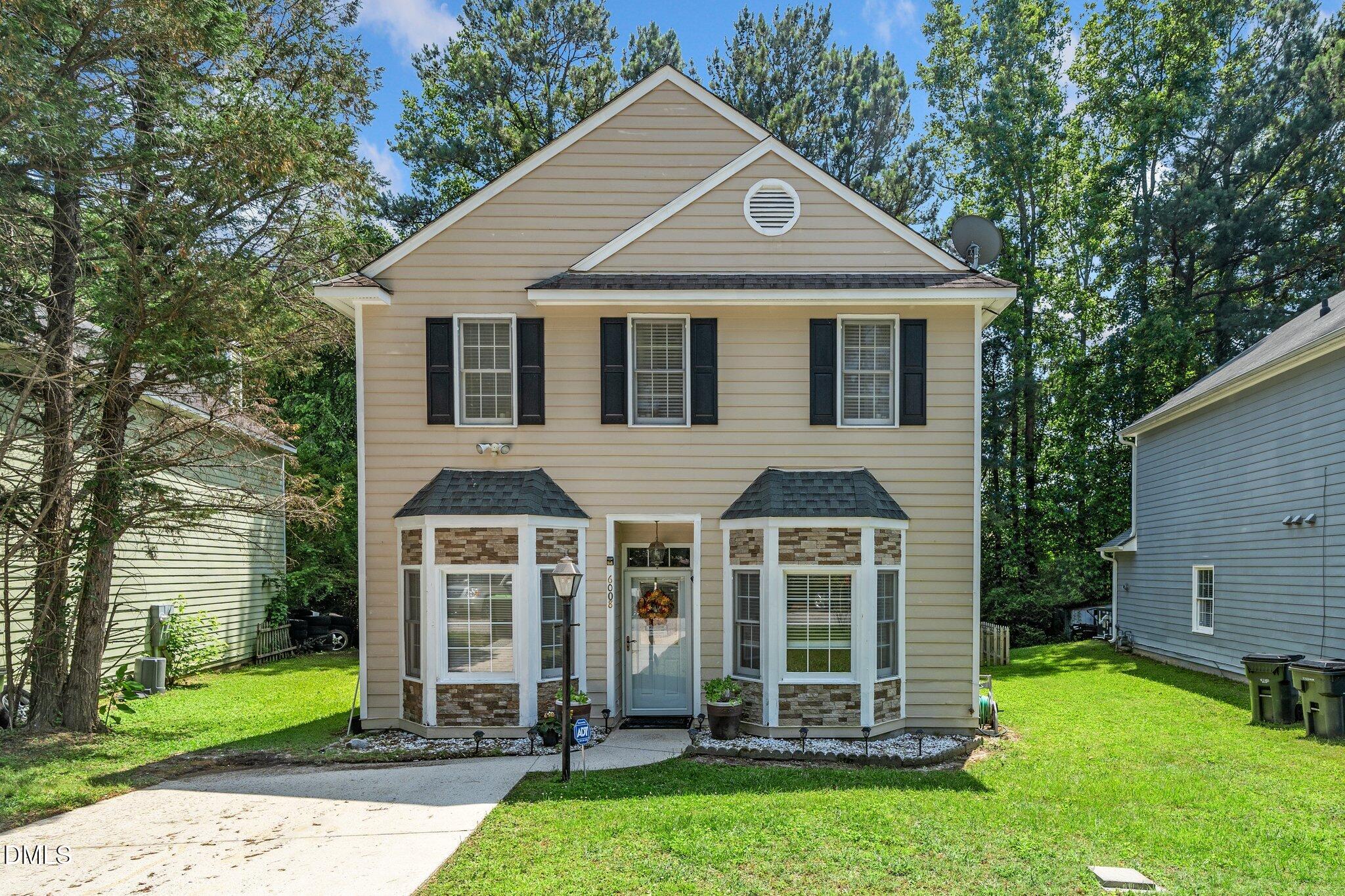 6008 River Lake Circle Raleigh, NC 27604 - Photo 1 of 16 a front view of a house with a yard