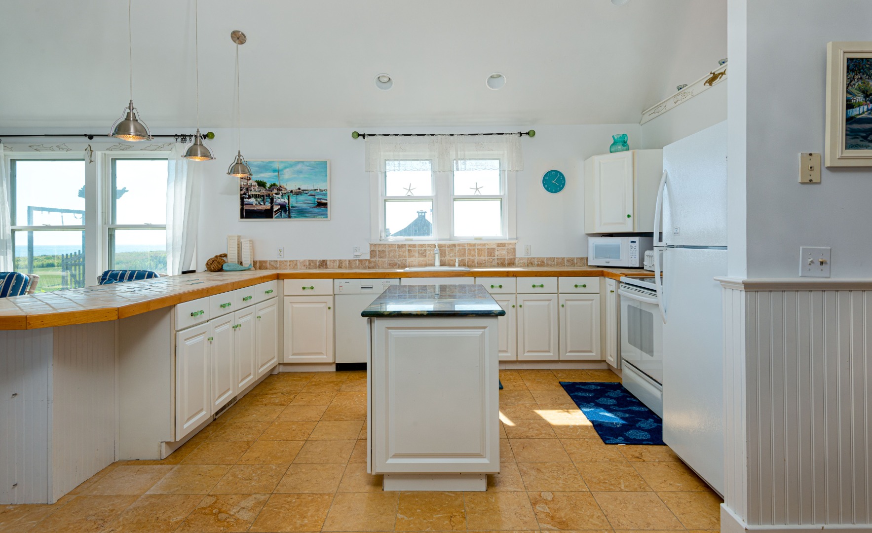 56 R Madequecham Valley Road Nantucket, MA 02554 - Photo 29 of 52 a kitchen with a sink stove and cabinets