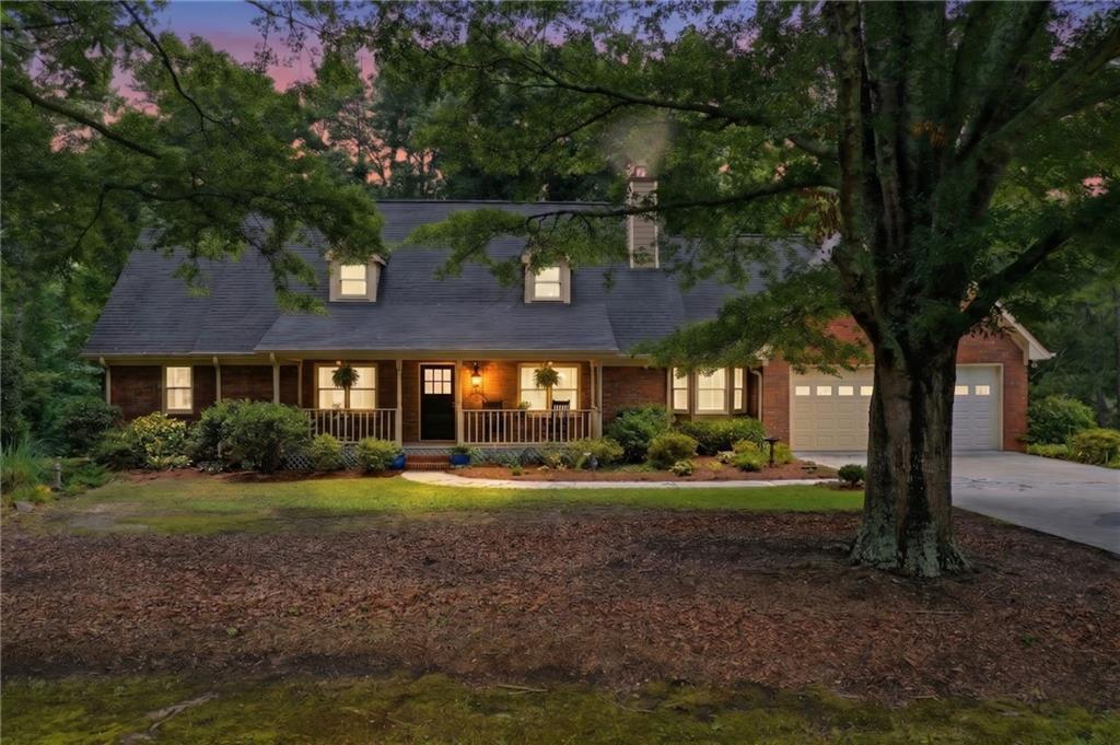 4891 Bill Cheek Road Auburn, GA 30011 - Photo 1 of 99 a front view of a house with a yard and green space