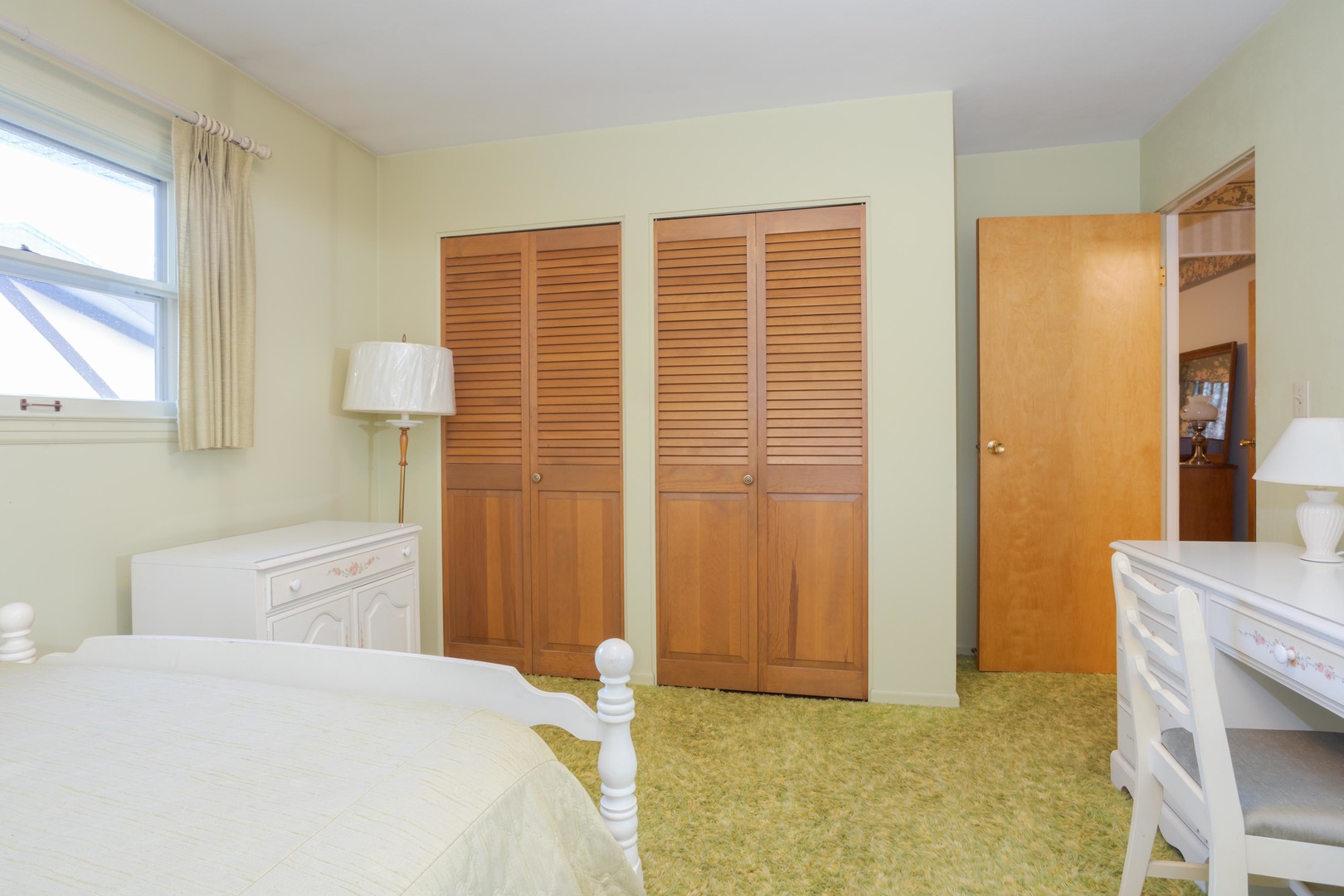 11 Manor Drive Pontiac, IL 61764 - Photo 19 of 45 a bedroom with a bed and a table in it