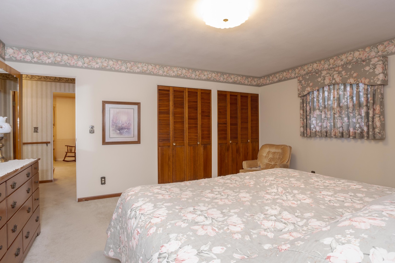 11 Manor Drive Pontiac, IL 61764 - Photo 25 of 45 a bedroom with a large bed and wooden floor