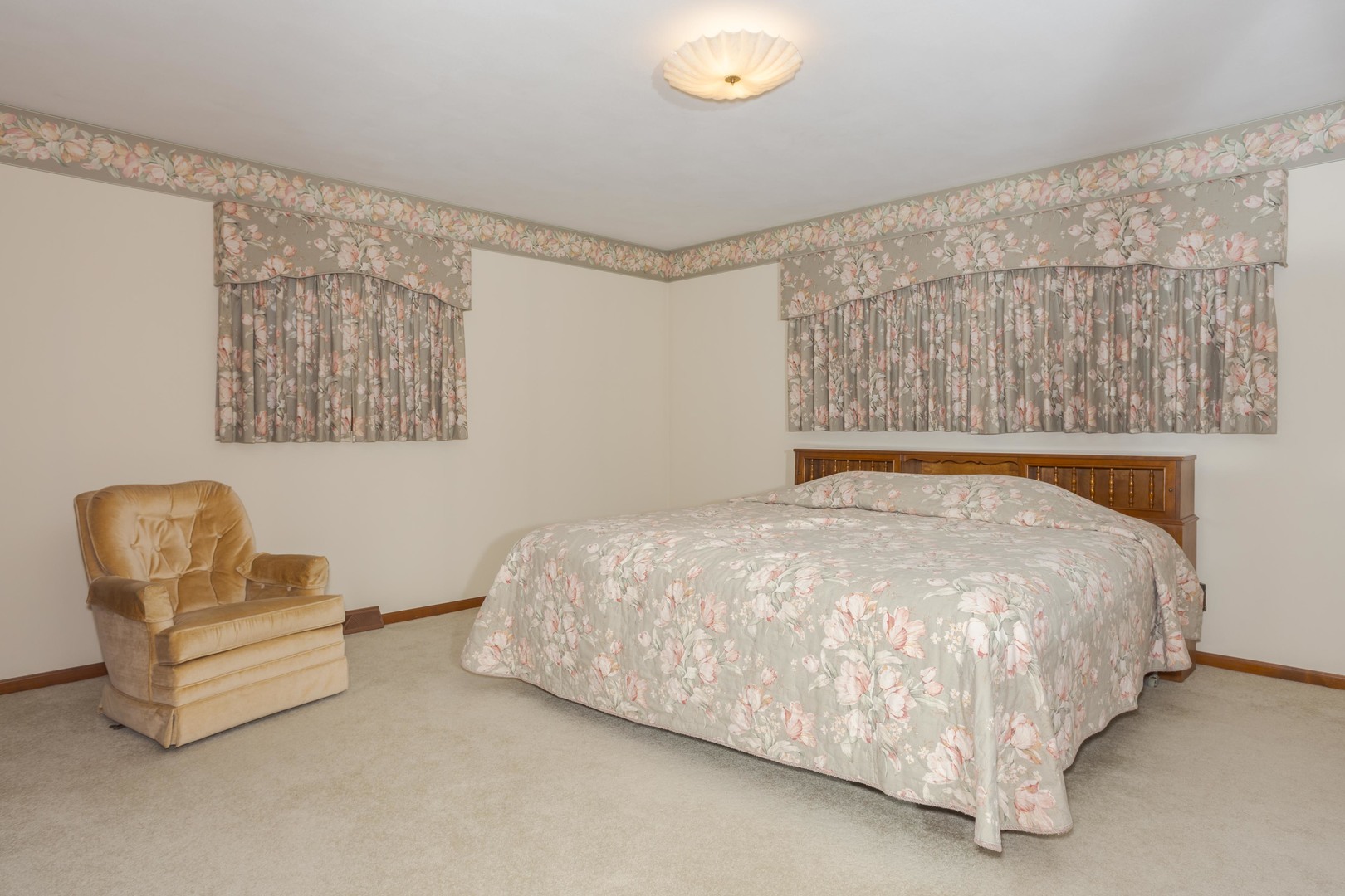 11 Manor Drive Pontiac, IL 61764 - Photo 27 of 45 a bed sitting in a bedroom next to a lamp with rug and a lamp