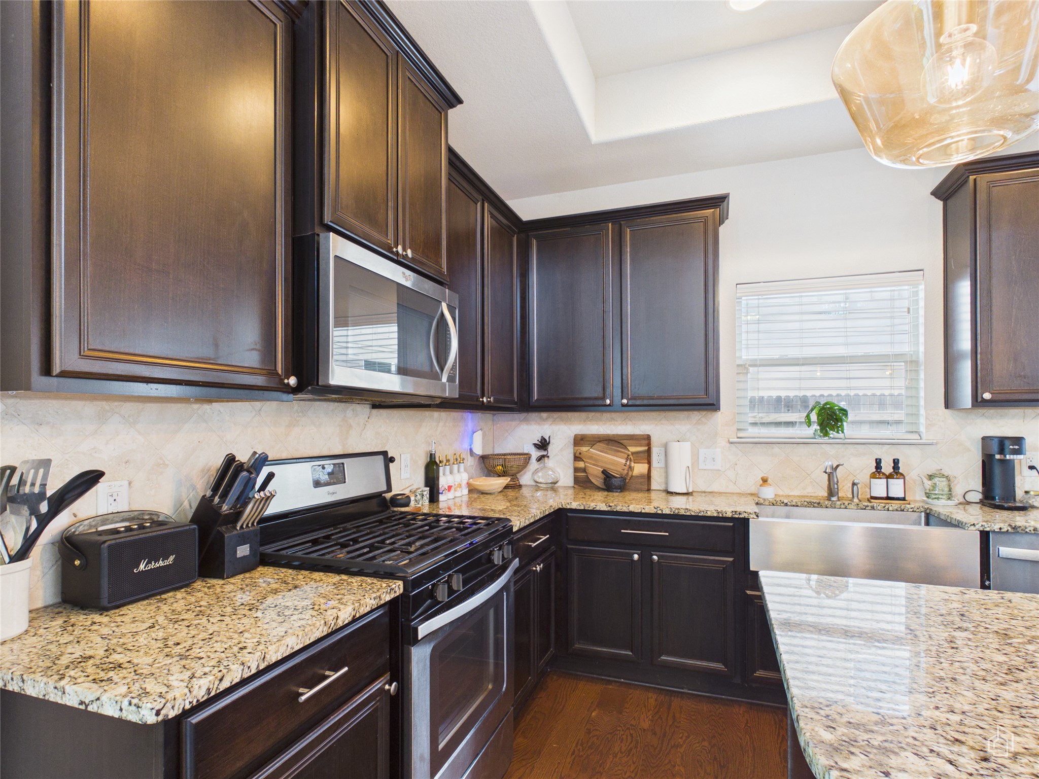 9310 Tanager Way Austin, TX 78748 - Photo 6 of 32 Culinary delights await in this chef's kitchen featuring ample cabinetry and natural illumination.