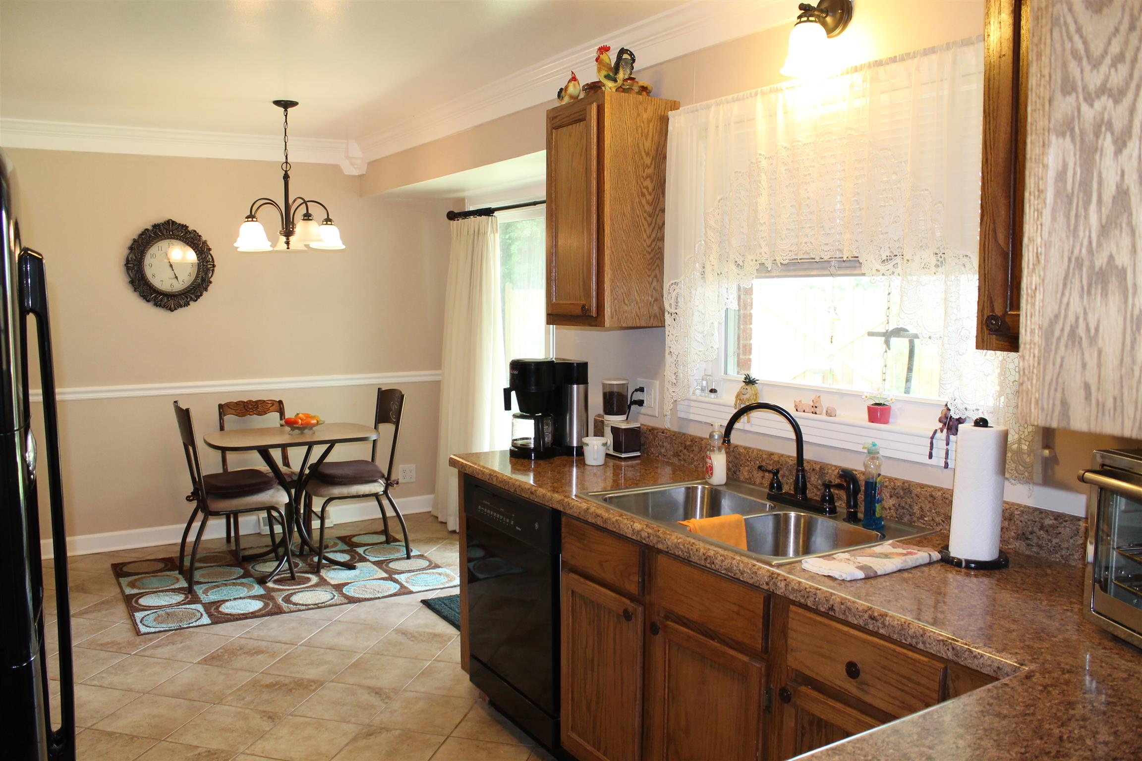 107 Lakeview Drive Dickson, TN 37055 - Photo 19 of 30 a kitchen with a table chairs stove and sink