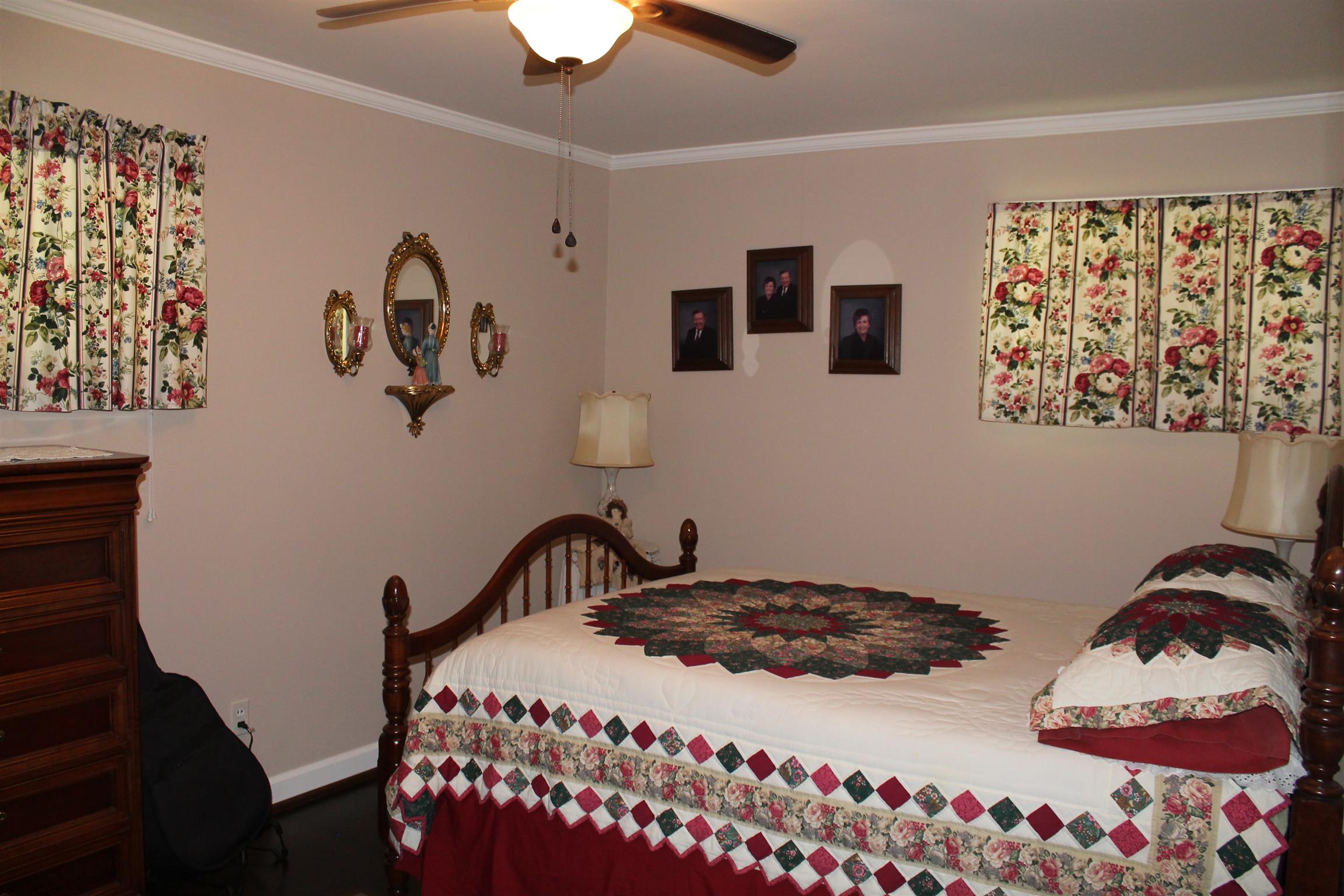 107 Lakeview Drive Dickson, TN 37055 - Photo 27 of 30 a bedroom with a bed and a painting on the wall