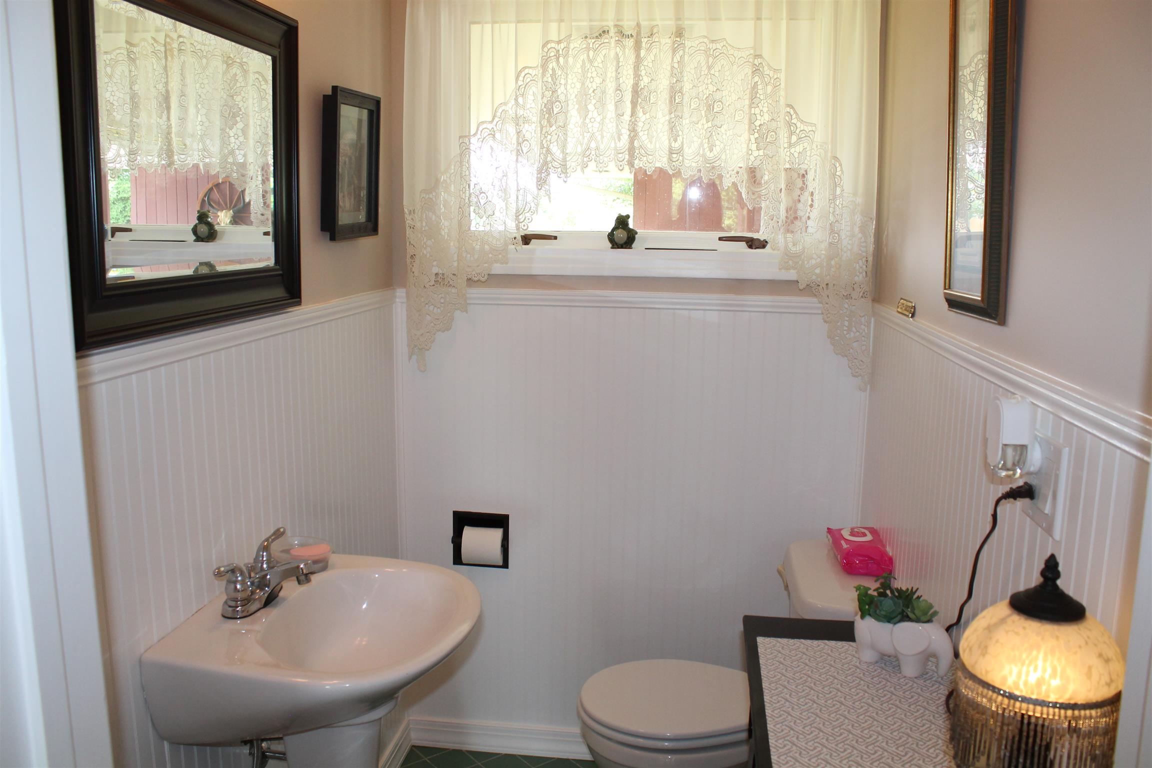 107 Lakeview Drive Dickson, TN 37055 - Photo 28 of 30 a bathroom with a toilet a sink and a window
