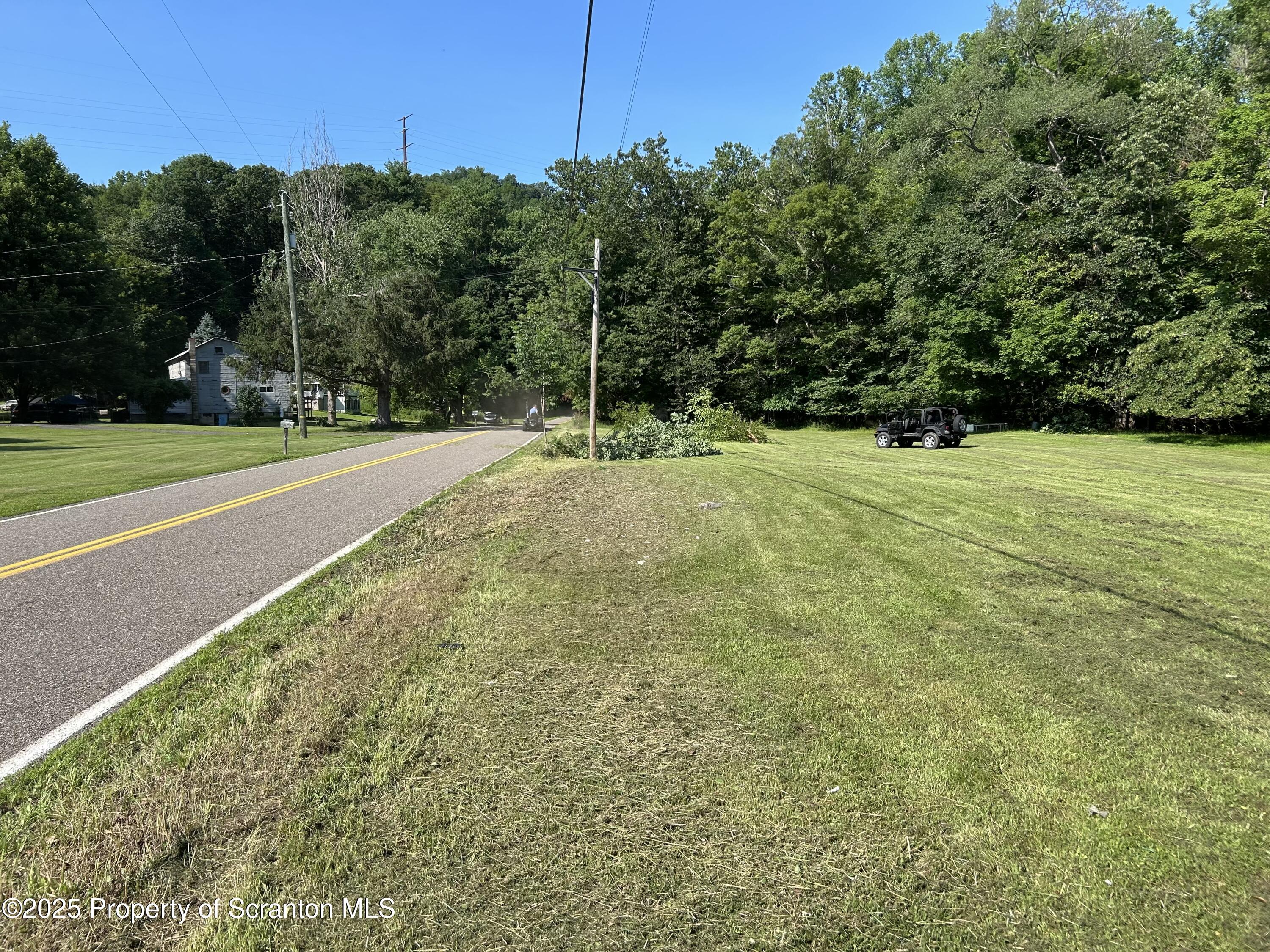 Lot 18 Ruckle Hill Road Wapwallopen, PA 18660 - Photo 2 of 4 a view of a field with trees in the background